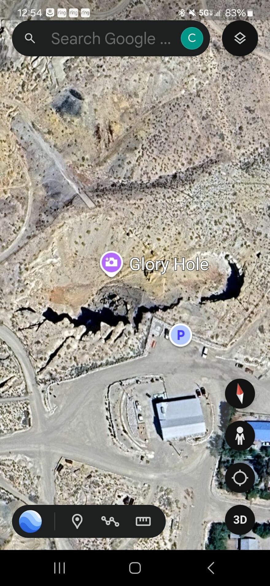 Strange sight on Google Earth showing an industrial area labeled "Glory Hole" surrounded by roads.