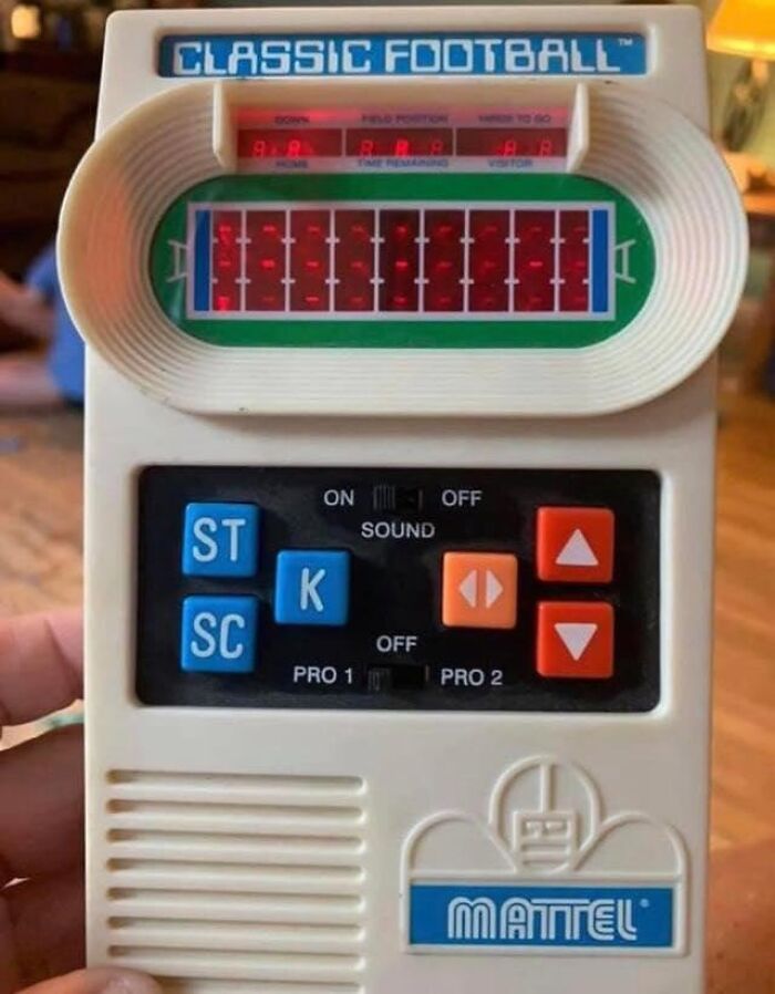 80s nostalgia handheld electronic football game with LED display and control buttons.