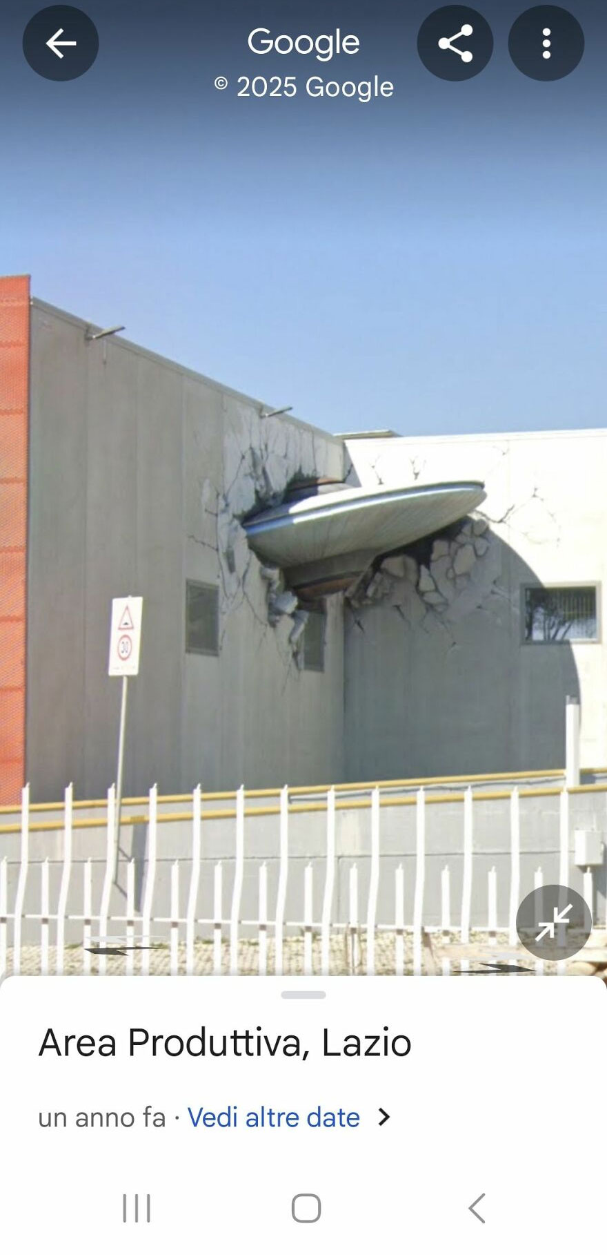 Strange sight on Google Earth: a UFO crashing into a building wall in Area Produttiva, Lazio.