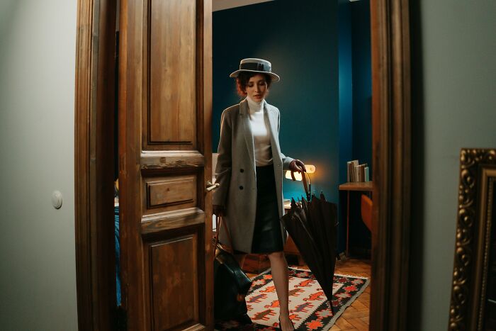 A person in vintage attire enters a room, illustrating activities losing appeal for older adults.