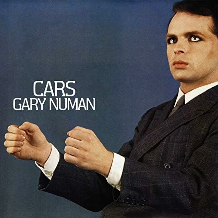 Gary Numan on the "Cars" album cover in a suit, representing '70s songs that still slap.