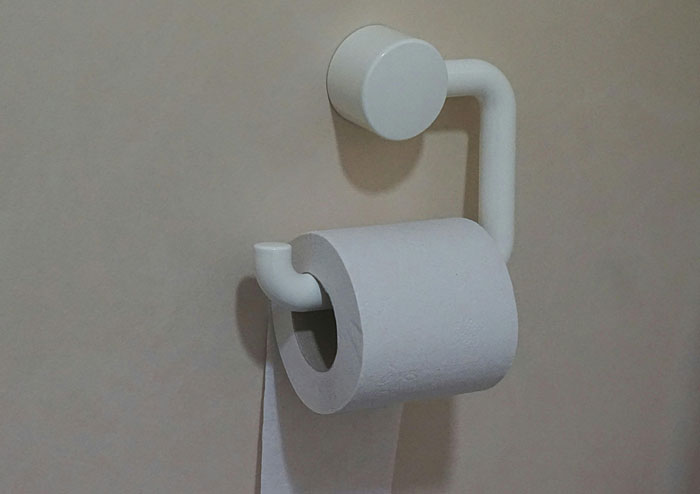 Creative toilet paper holder showcasing quality hacks with a unique design that seems like a cheat code for easy usage.