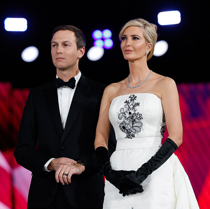 Man in tuxedo and woman in elegant dress with gloves, embodying elegance and class at formal event.