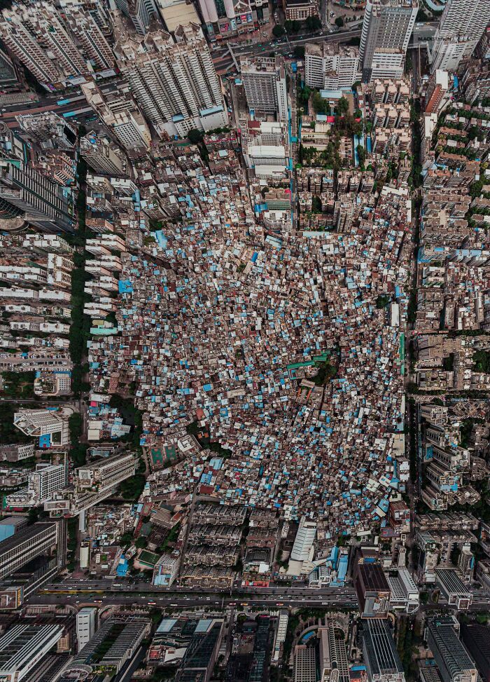 Aerial view of a dense urban area illustrating urban hell with crowded buildings and narrow streets.