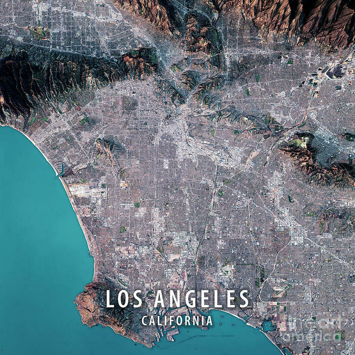 Aerial view of urban hell in Los Angeles, California, showing dense cityscape and surrounding landscape.