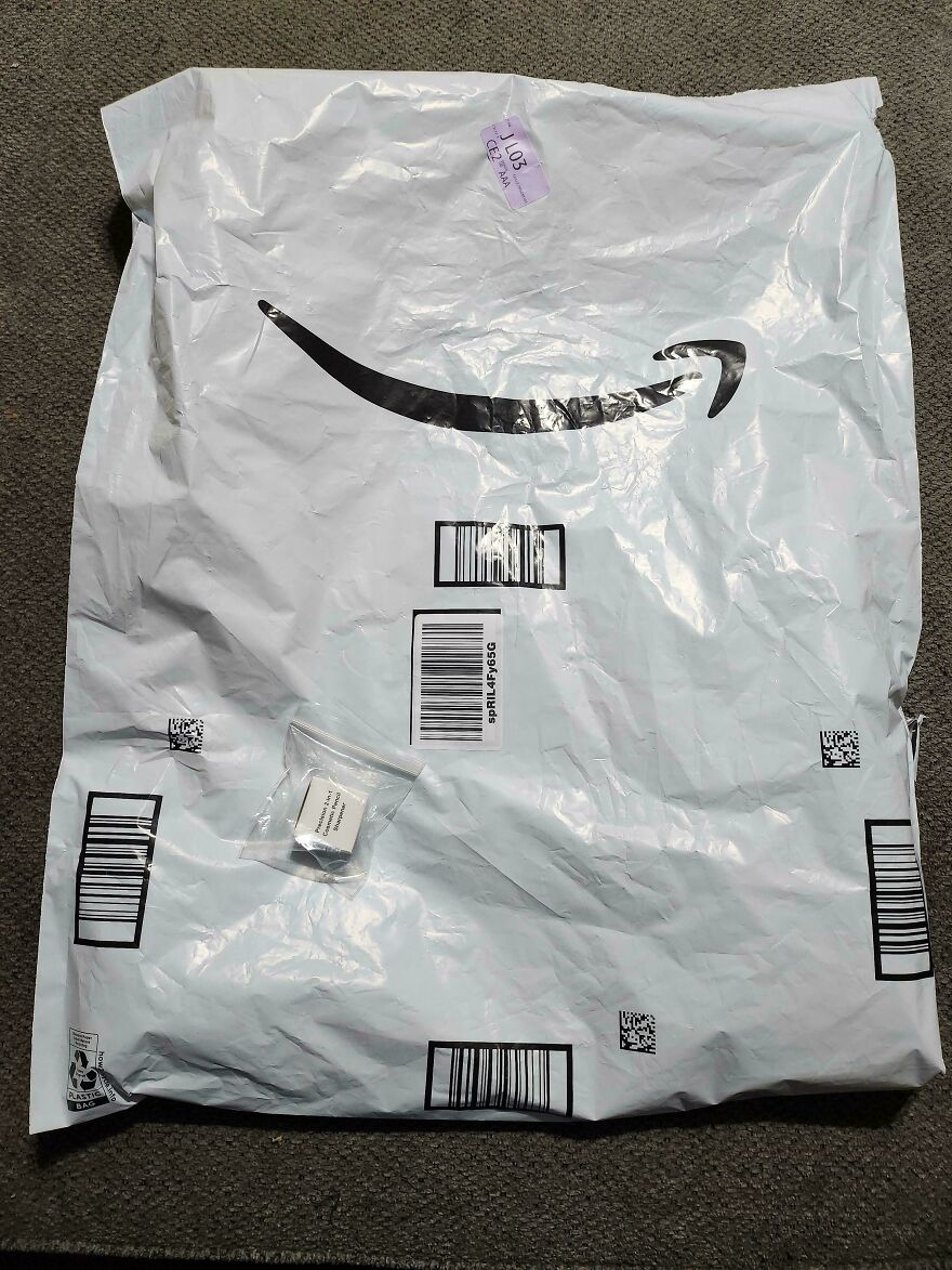 Large mailing bag highlighting wasteful unnecessary packaging for a small item.