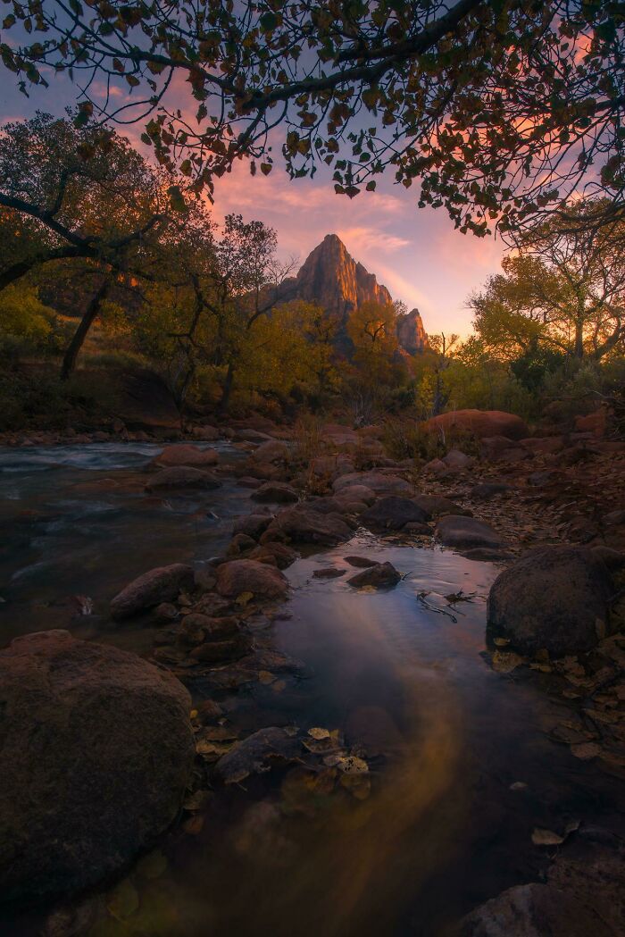 Incredible world photo of sunset over a serene river in a picturesque mountain landscape.