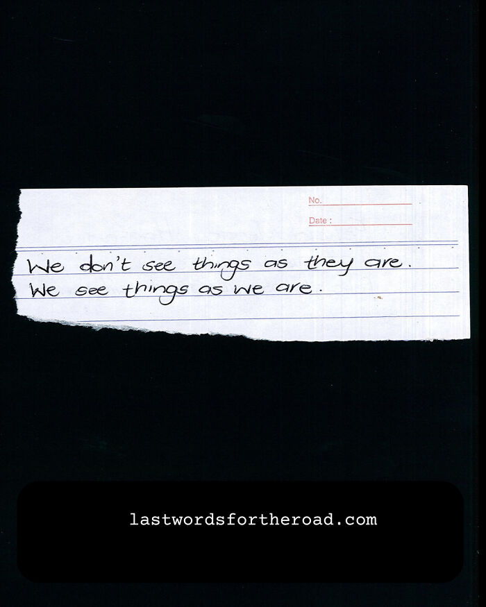 Handwritten quote on a torn paper: "We don’t see things as they are. We see things as we are."