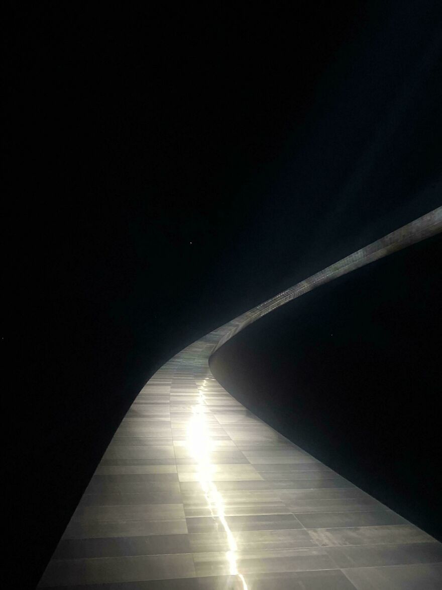 A shiny metallic path visually resembling a space journey against a dark background.