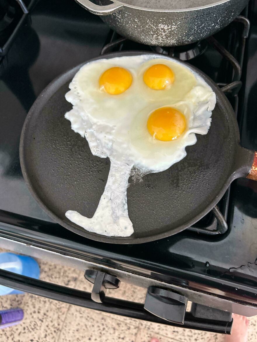 Fried eggs in a pan resembling a wine glass, illustrating things look like other things.