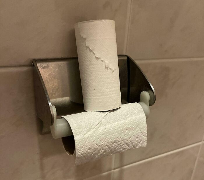 Empty toilet paper roll left on the holder by horrible roommates.