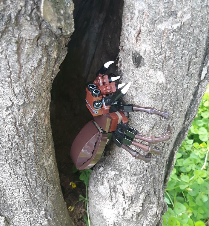 LEGO beetle build nestled in a tree, showcasing creative Cool-LEGO-Builds in a natural setting.