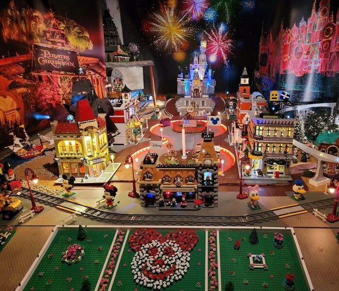 Cool LEGO builds featuring a miniature Disney theme park with vibrant fireworks and detailed architectural models.