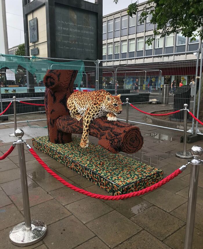 Lifelike leopard sculpture made of LEGO bricks on display outdoors, a stunning example of cool LEGO builds.