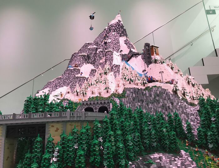 LEGO mountain build featuring detailed trees and a bridge, showcasing remarkable Cool-LEGO-Builds creativity.