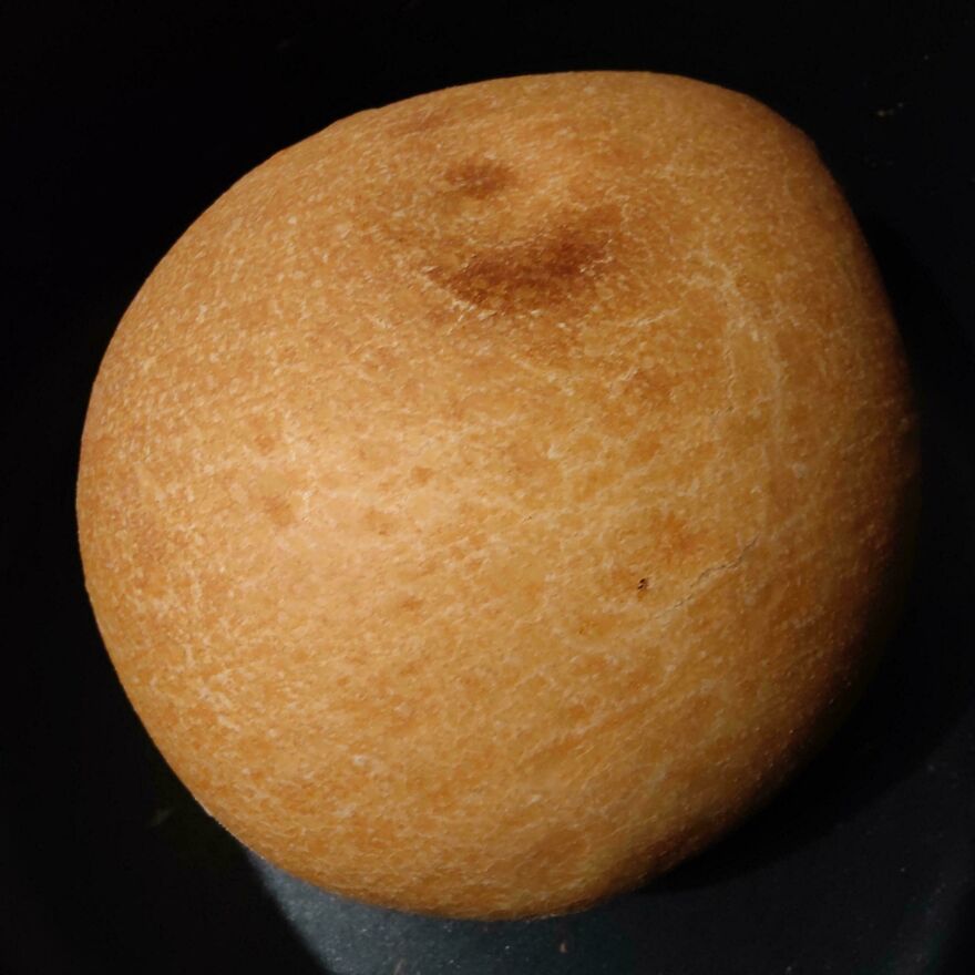 A loaf of bread resembling a potato due to its shape and texture.