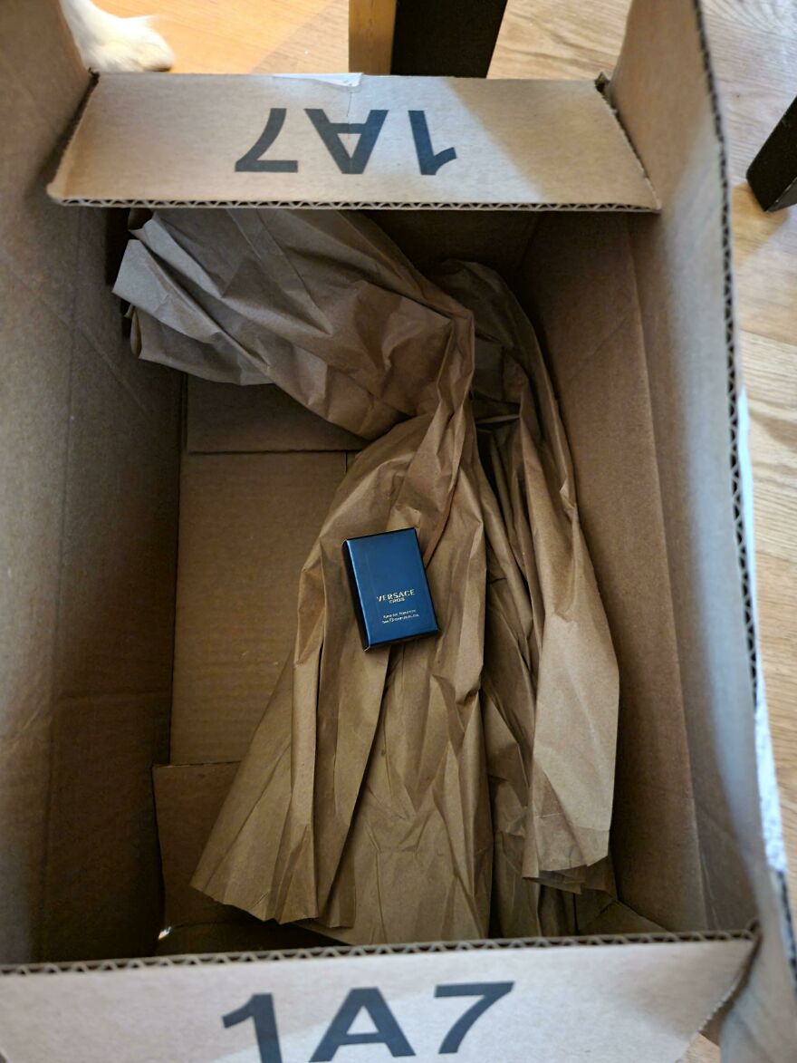 Large box with wasteful unnecessary packaging for a small Versace item inside.