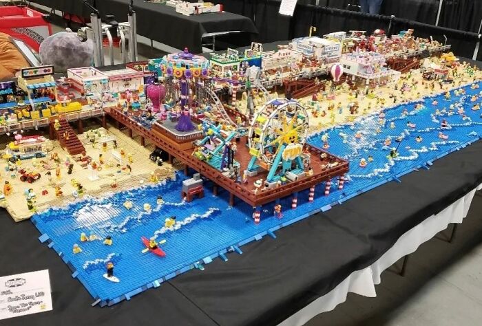 Intricate LEGO beach and amusement park scene, showcasing cool LEGO builds with vibrant colors and detailed structures.