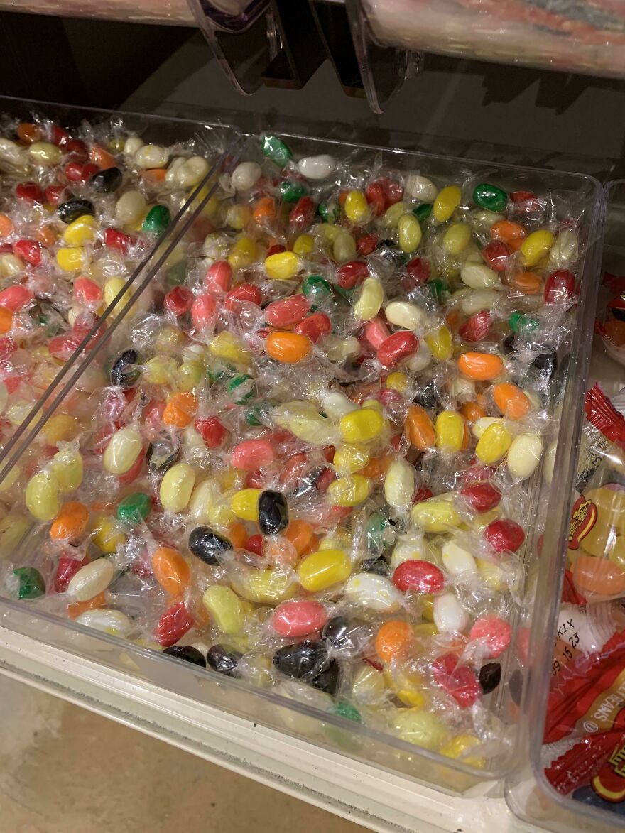 Individually wrapped jelly beans in plastic highlight wasteful, unnecessary packaging.