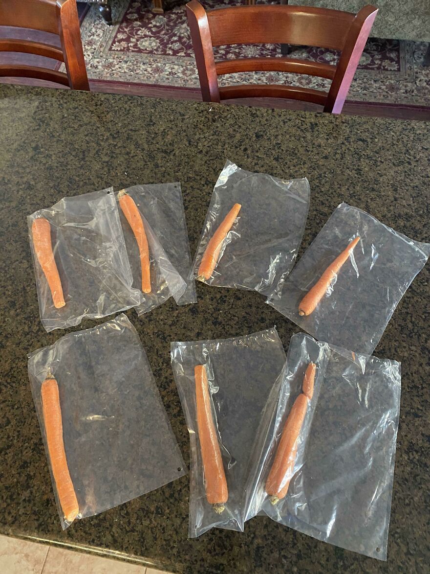 Carrots each wrapped in plastic, demonstrating wasteful unnecessary packaging.