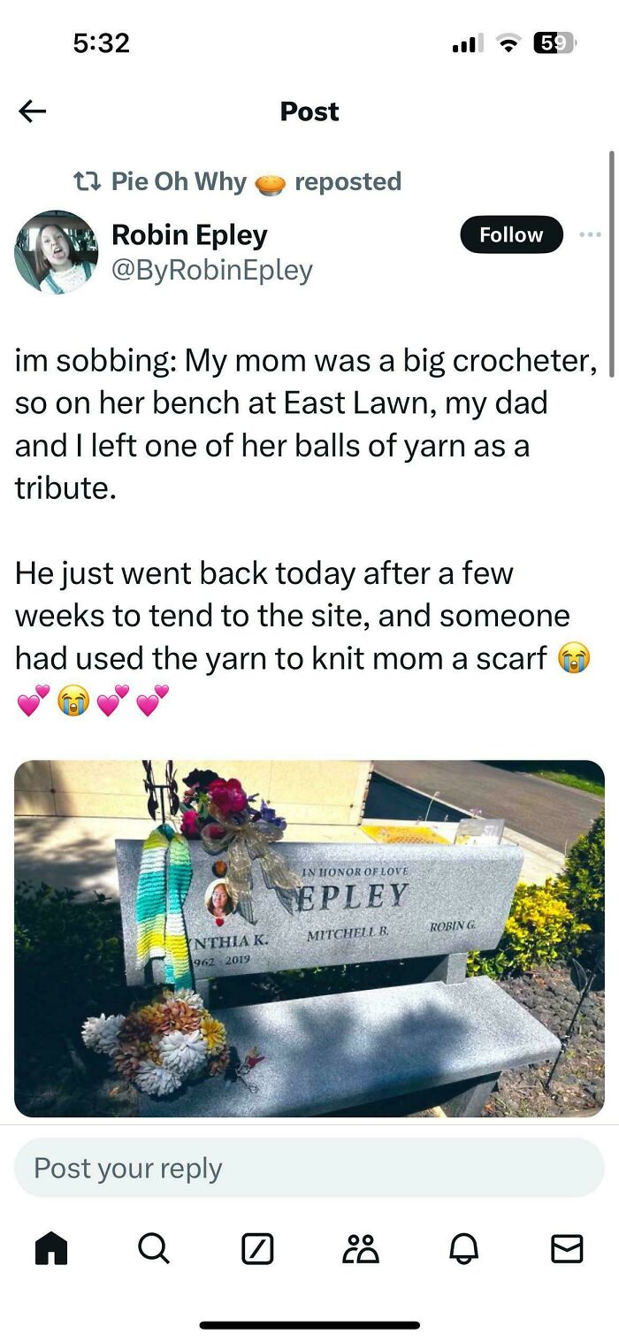 Memorial bench with crochet piece and flowers honoring a crocheter.