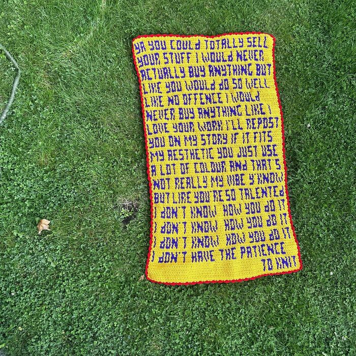 Crocheted text artwork on grass with colorful yarn displaying various messages.