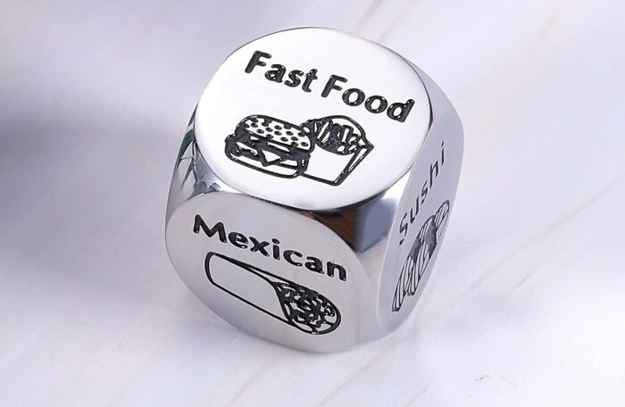 Novelty product dice with options like fast food, Mexican, and sushi engraved on its sides.