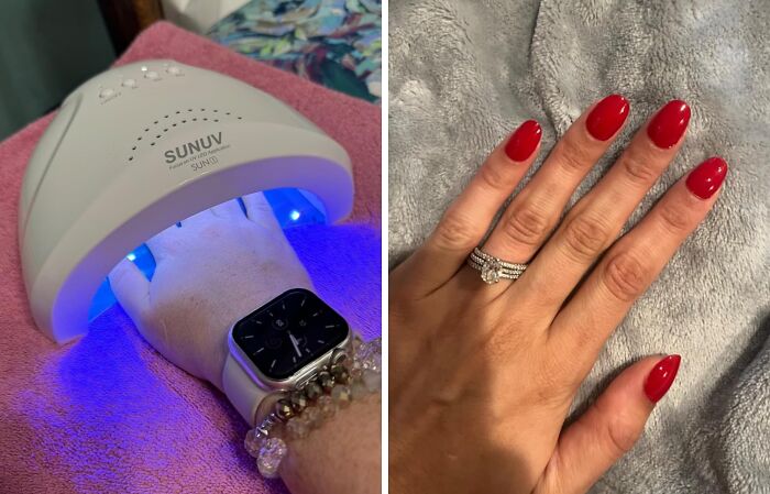 UV nail dryer used during a manicure, showcasing bright red polished nails.