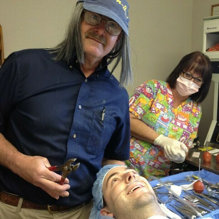 Man with a long-haired wig holding pliers, nurse in colorful scrubs, and patient smiling: Funny Camera Roll Finds.