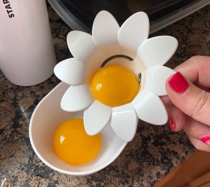 Egg yolk separator with a daisy design, demonstrating a neat cooking tool perfect for a less-mess kitchen.