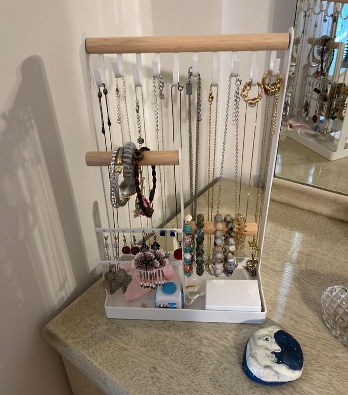 Jewelry organizer displaying necklaces, bracelets, and earrings for a less-mess solution in 2025.