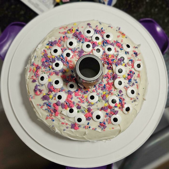 Funny cake with googly eyes and colorful sprinkles, reflecting a hilarious kids' creation.