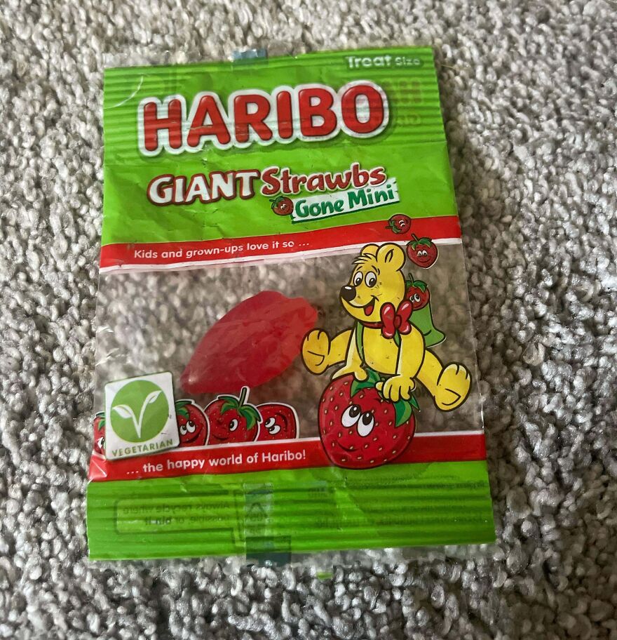 Empty candy wrapper of Haribo Giant Strawbs, highlighting wasteful unnecessary packaging.