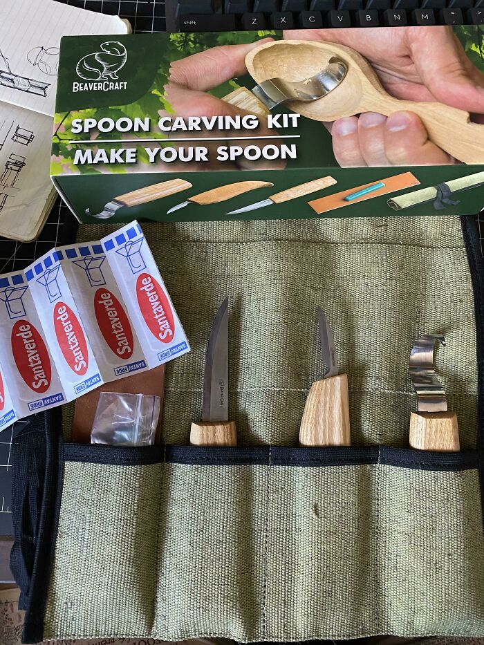 Spoon carving kit with various tools and sandpaper, showcasing cool products with surprises.