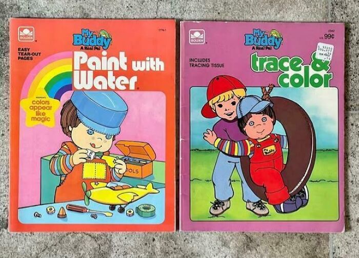 80s nostalgia pictures, featuring "My Buddy" activity books, "Paint with Water" and "Trace & Color" on a concrete background.