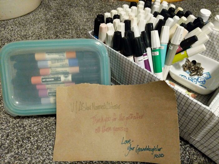 80s nostalgia items: assorted markers in containers with a handwritten note.