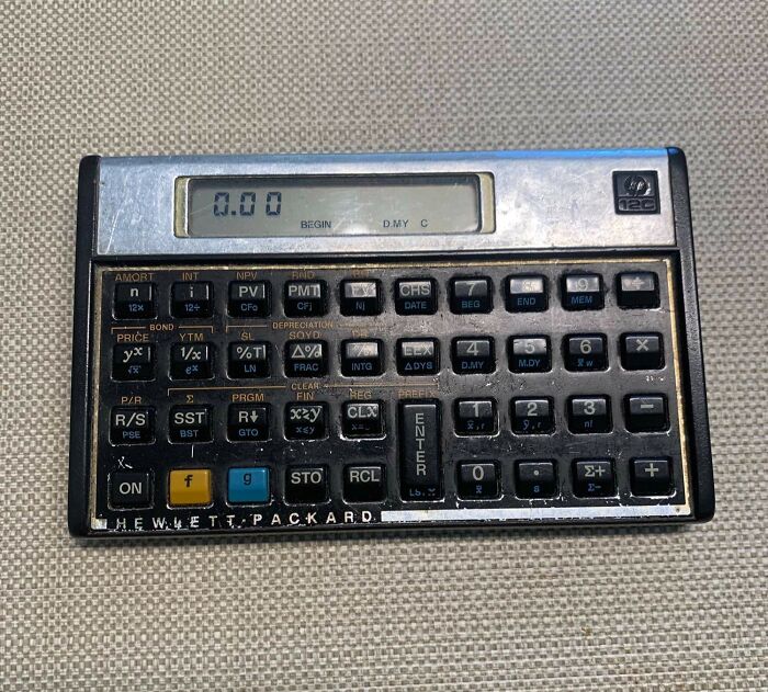 Hewlett-Packard calculator from the 1980s, showcasing 80s nostalgia with vintage keys and display.