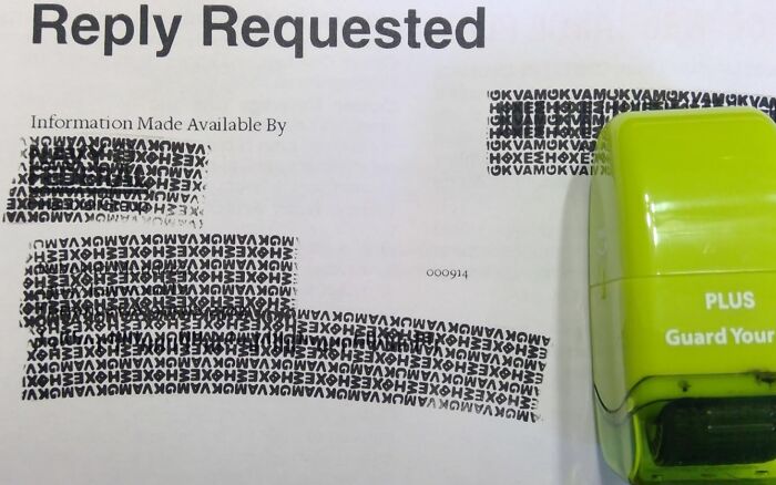 Stamp and document with redacted text promoting responsible information management.