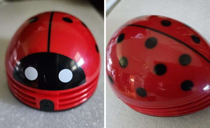 Ladybug-themed desk vacuum cleaner, a fun office supply enhancing work enjoyment.