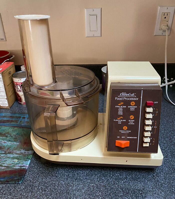 Vintage 80s food processor with brown and beige design on a kitchen counter.