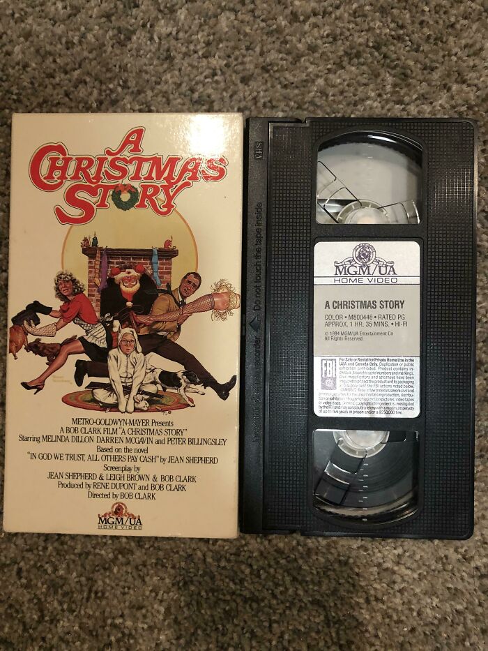 80s Nostalgia: "A Christmas Story" VHS tape and cover on a carpeted floor.