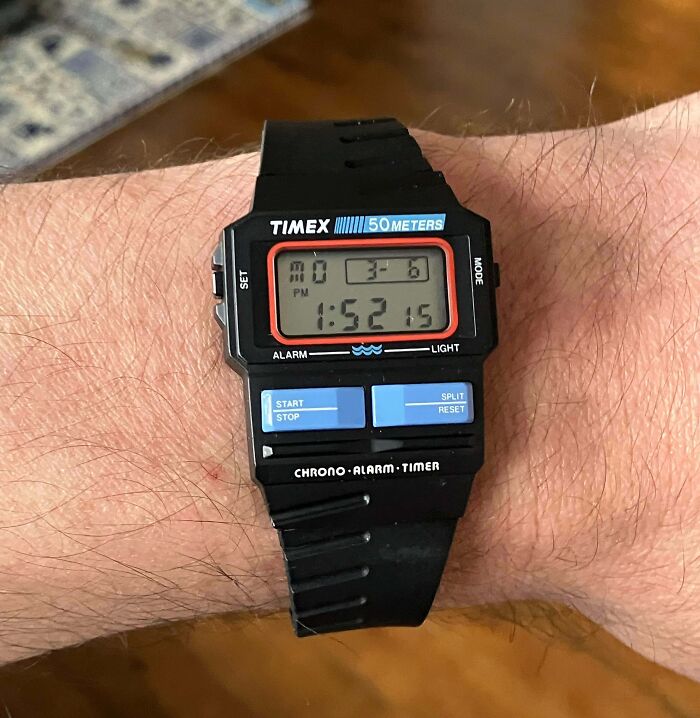 Vintage Timex digital wristwatch on wrist, symbolizing 80s nostalgia.