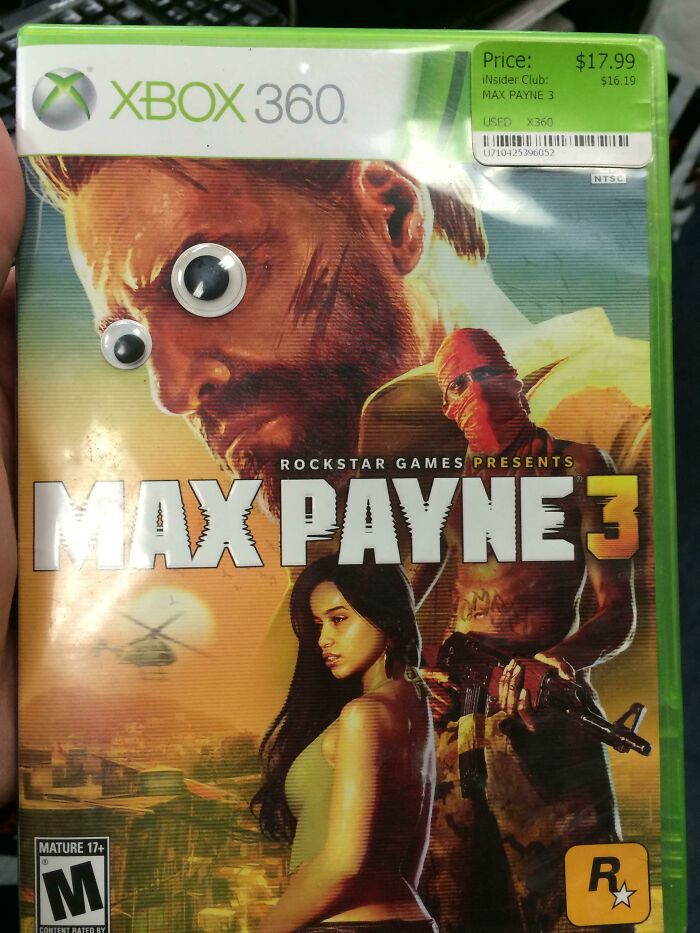 Xbox 360 Max Payne 3 cover with googly eyes added, capturing a funny-camera-roll-finds moment.