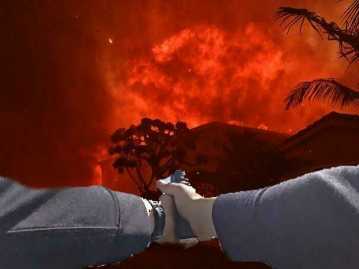 Hands pointing at a dramatic red sky with flames, highlighting a boring dystopia scenario.