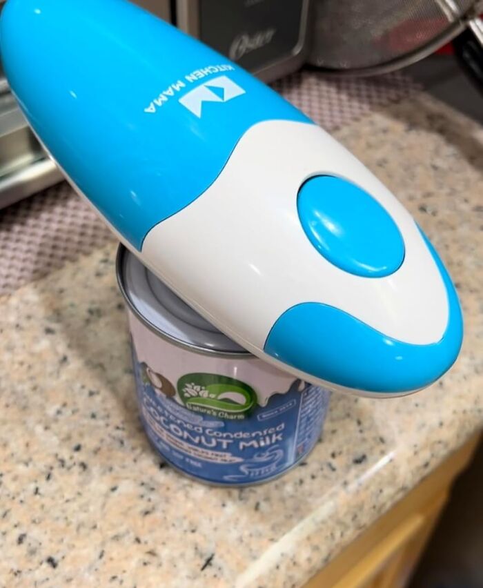 Electric can opener on a kitchen counter, enhancing cooking skills.