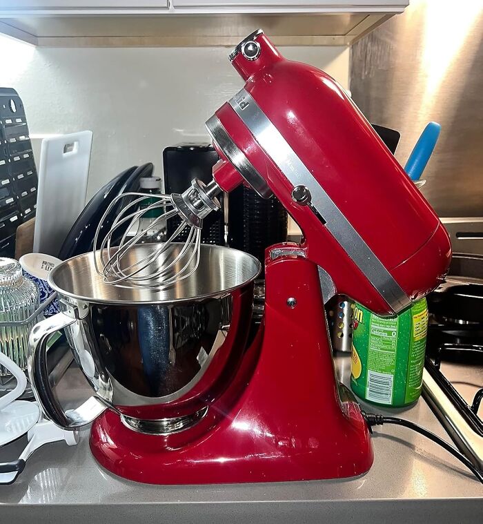 Red stand mixer on kitchen counter, perfect for getting better at cooking.