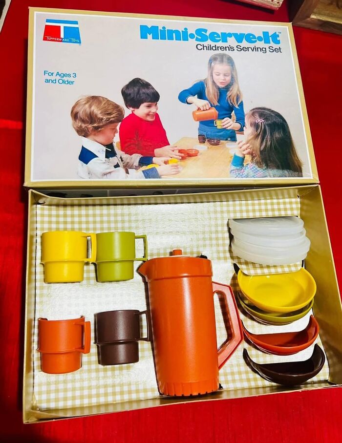 Vintage Gen X children's toy set with cups and pitcher in retro colors.