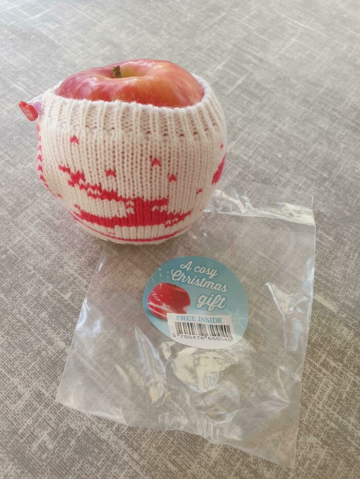 Apple in a knitted sleeve with packaging, a cool product with surprises.