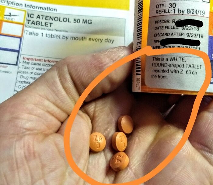 Prescription label error with incorrect orange pills in hand, highlighting infuriating local pharmacies issue.