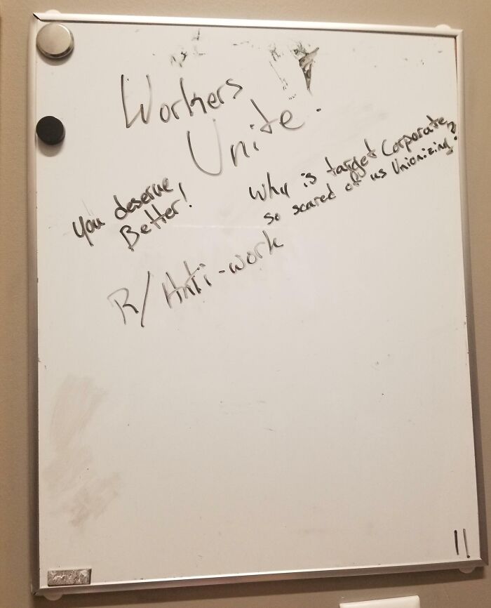 Whiteboard with "Workers Unite," emphasizing people quitting jobs and advocating for better conditions.